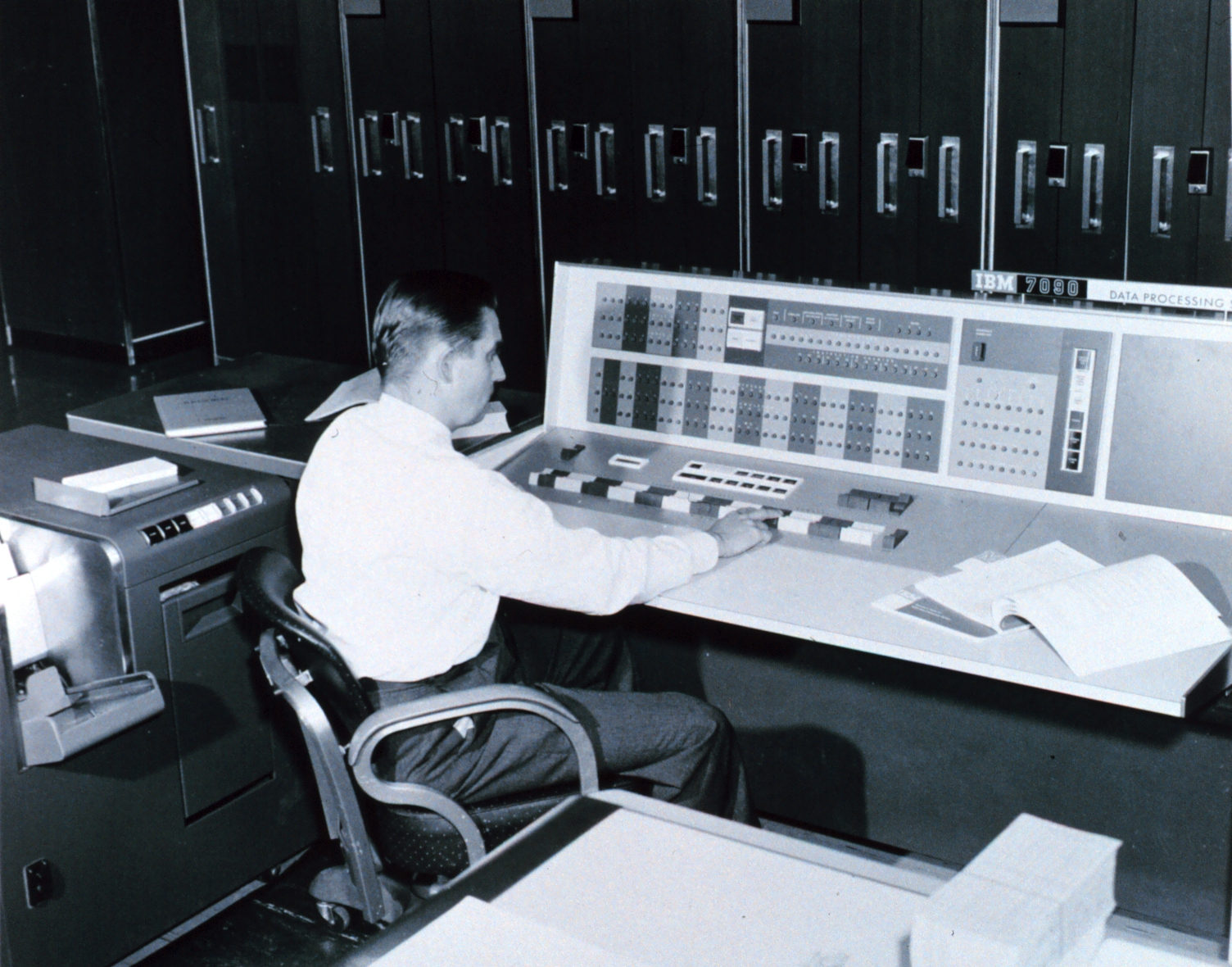 A meteorologist at the console of an IBM 7090 used for numerical weather prediction, 1965